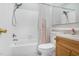Bathroom featuring tile shower, vanity with lighting and toilet at 1738 Quail Ridge Rd, Raleigh, NC 27609