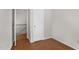 Bedroom featuring neutral walls, wood floors, and closet with white door at 1738 Quail Ridge Rd, Raleigh, NC 27609