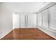 Bright bedroom featuring wood floors, neutral walls, and large windows offering lots of natural light at 1738 Quail Ridge Rd, Raleigh, NC 27609