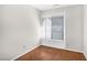 Bedroom featuring neutral walls, wood floors, and window with white blinds at 1738 Quail Ridge Rd, Raleigh, NC 27609