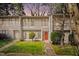 Charming multi-level townhome showcasing manicured landscaping, and neutral exterior paint at 1738 Quail Ridge Rd, Raleigh, NC 27609