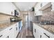 Well-equipped kitchen with granite countertops and modern stainless-steel appliances at 1738 Quail Ridge Rd, Raleigh, NC 27609