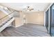 Bright living room featuring wood floors, ceiling fan and sliding door access to patio at 1738 Quail Ridge Rd, Raleigh, NC 27609