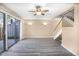 Spacious living room featuring modern flooring and sliding glass door to the outdoors at 1738 Quail Ridge Rd, Raleigh, NC 27609