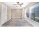 Bright living area with a ceiling fan and large windows showcasing a wooded, private area at 1738 Quail Ridge Rd, Raleigh, NC 27609