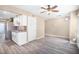 Spacious living area seamlessly flows into the kitchen featuring modern stainless-steel appliances at 1738 Quail Ridge Rd, Raleigh, NC 27609