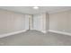 Bedroom with neutral decor, light gray carpet, and a closet, providing a calm and inviting space at 210 Circle Dr, Smithfield, NC 27577