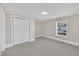 Bright bedroom with neutral walls, carpet flooring, and a window for natural light at 210 Circle Dr, Smithfield, NC 27577