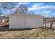 View of a detached garage featuring a simple design with a door in a grassy yard at 210 Circle Dr, Smithfield, NC 27577