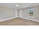 Bright living room with fresh paint, wood-look flooring, and neutral trim offers a welcoming space at 210 Circle Dr, Smithfield, NC 27577