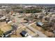 This aerial view showcases the neighborhood and surrounding trees at 231 Patterson Dr, Roxboro, NC 27573