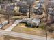 This aerial view showcases the home, driveway, and landscaping at 231 Patterson Dr, Roxboro, NC 27573