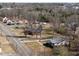 An aerial photo showcases the neighborhood and its proximity to town at 231 Patterson Dr, Roxboro, NC 27573