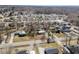 This aerial view highlights the neighborhood with its mature trees at 231 Patterson Dr, Roxboro, NC 27573