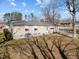 A view of the rear of the home showing the yard, house siding, and roof at 231 Patterson Dr, Roxboro, NC 27573