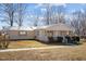 Charming single-story home with a welcoming front porch and neatly maintained landscaping at 231 Patterson Dr, Roxboro, NC 27573