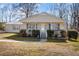 Charming single-story home features a covered front porch, manicured landscaping, and a welcoming entrance at 231 Patterson Dr, Roxboro, NC 27573