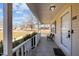 Inviting covered front porch with a chair seating area and views of the front yard and neighborhood at 231 Patterson Dr, Roxboro, NC 27573