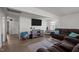 Cozy living room features a large television, a sofa, and neutral decor at 231 Patterson Dr, Roxboro, NC 27573