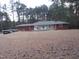 Charming ranch-style home with brick accents, front porch, and a spacious front yard, offering comfortable living at 2506 Poole Rd, Raleigh, NC 27610