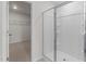 Bathroom with a glass door shower and access to a walk-in closet at 2561 Summersby Dr, Mebane, NC 27302