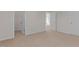 An expansive bedroom featuring neutral carpet, fresh paint, and multiple closets for ample storage space at 2561 Summersby Dr, Mebane, NC 27302