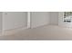 Neutral-toned bedroom with connecting doorway and large window offering natural light at 2561 Summersby Dr, Mebane, NC 27302