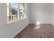 Bright room with hard wood floors, freshly painted walls, and a large window letting in natural light at 2561 Summersby Dr, Mebane, NC 27302