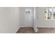 Clean entryway featuring white walls, a white front door with glass panes, and hard wood floors at 2561 Summersby Dr, Mebane, NC 27302