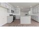 The kitchen is equipped with stainless steel appliances, granite countertops, and a large island at 2561 Summersby Dr, Mebane, NC 27302