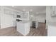 The kitchen is equipped with stainless steel appliances, granite countertops, and a large island at 2561 Summersby Dr, Mebane, NC 27302