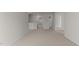 Open loft area with neutral carpeting and ample space for versatile use at 2561 Summersby Dr, Mebane, NC 27302