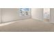 Bedroom features plush carpeting, a window and an en suite bathroom at 262 Palm Dr, Sanford, NC 27332