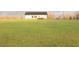 Expansive, level backyard, with a view of the house from the lawn at 29 Hinshaw Shop Rd, Liberty, NC 27298