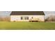 Exterior view of the home with a new deck and spacious backyard at 29 Hinshaw Shop Rd, Liberty, NC 27298