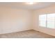 Bright bedroom featuring neutral carpet, a window for natural light, and fresh, white paint at 29 Hinshaw Shop Rd, Liberty, NC 27298