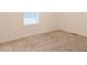 Cozy bedroom featuring neutral carpet and a window for natural light at 29 Hinshaw Shop Rd, Liberty, NC 27298