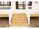 Inviting home entrance with a classic wooden porch, white railings, and prominent house number at 29 Hinshaw Shop Rd, Liberty, NC 27298