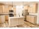 Modern kitchen with stainless steel appliances, central island, and plenty of cabinet space at 29 Hinshaw Shop Rd, Liberty, NC 27298