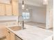 Close-up of a bright kitchen island featuring hardwood floors, and marble countertops at 29 Hinshaw Shop Rd, Liberty, NC 27298