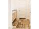 A cozy mudroom with wood-look flooring, built-in cabinets, and entry doors at 29 Hinshaw Shop Rd, Liberty, NC 27298
