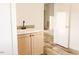 Mud room features wooden cabinets, modern sink, and wood-look floors at 29 Hinshaw Shop Rd, Liberty, NC 27298