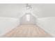 Finished attic space with neutral carpeting and paint, recessed lighting, and window at 2909 Hawtree Dr, Raleigh, NC 27613