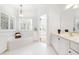 Bright bathroom with a soaking tub, plantation shutters, and a vanity at 2909 Hawtree Dr, Raleigh, NC 27613