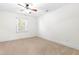 Bedroom featuring carpet flooring, a ceiling fan, and a window at 2909 Hawtree Dr, Raleigh, NC 27613