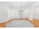 Bright dining room with hardwood floors, bay windows, and a chandelier at 2909 Hawtree Dr, Raleigh, NC 27613