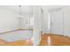Bright foyer with a white front door and hardwood floors; adjacent to the dining area at 2909 Hawtree Dr, Raleigh, NC 27613