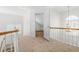 Upstairs hallway with carpet flooring and natural light from the windows at 2909 Hawtree Dr, Raleigh, NC 27613