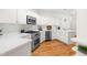 Well-lit kitchen with stainless steel appliances and white countertops at 2909 Hawtree Dr, Raleigh, NC 27613