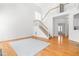 Bright and spacious living room features a staircase, hardwood floors, and abundant natural light at 2909 Hawtree Dr, Raleigh, NC 27613